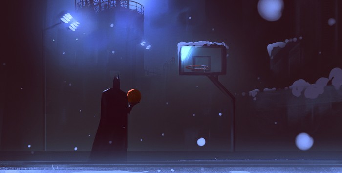 Batman holding a basketball on a snowy night