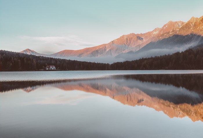 Lake reflection of mountains and forest