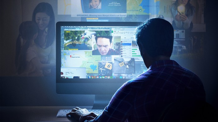 Man Searching for Margot Kim on Computer