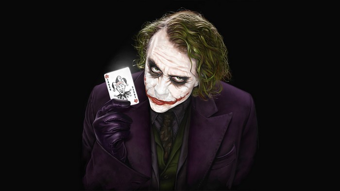 The Joker holding a playing card