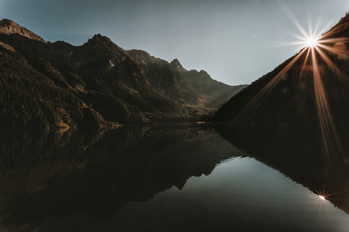 Mountains reflecting in a lake at sunrise