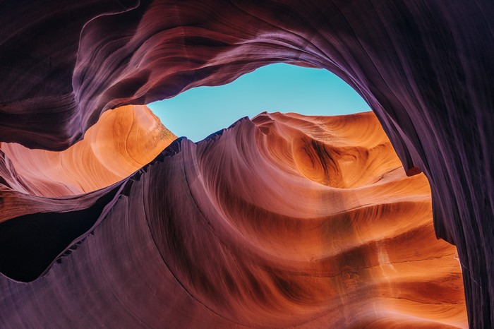 Antelope Canyon rock formations with blue sky