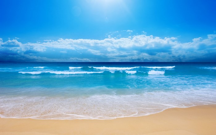 Beach with Waves and Blue Sky