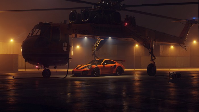 Porsche 911 GT2 RS parked under a helicopter