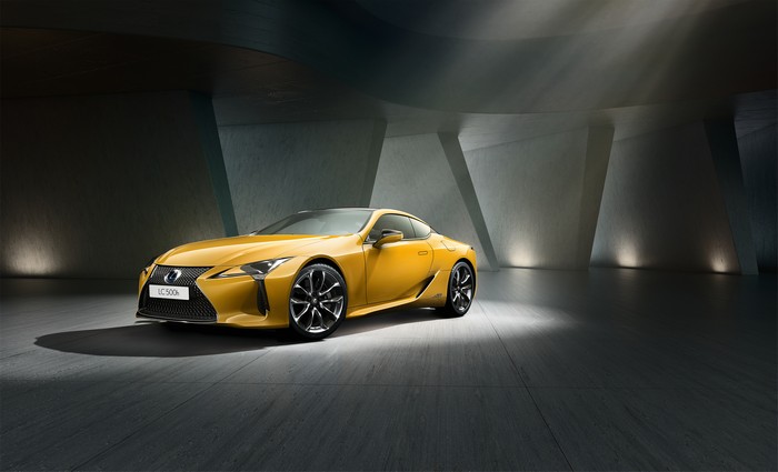 Yellow Lexus LC 500h Coupe in a Modern Garage
