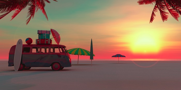 Vintage van on a beach at sunset