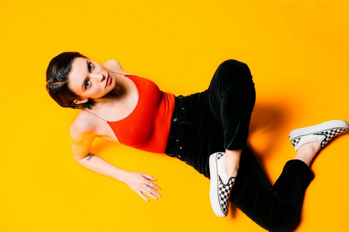 Meg Myers in red top and black pants