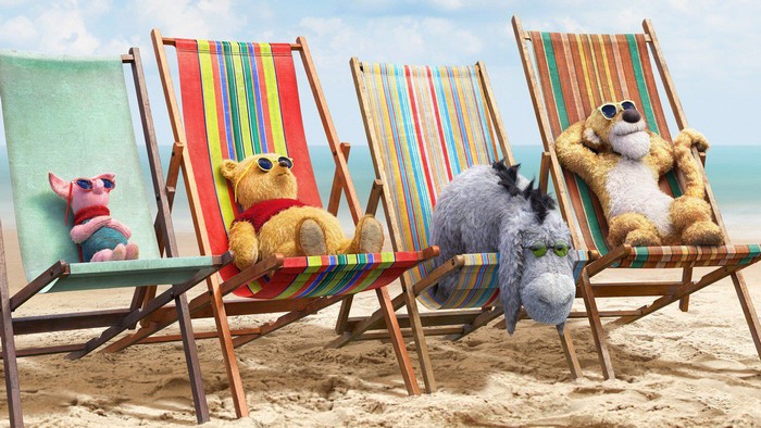 Winnie the Pooh, Piglet, Eeyore, and Tigger on the beach