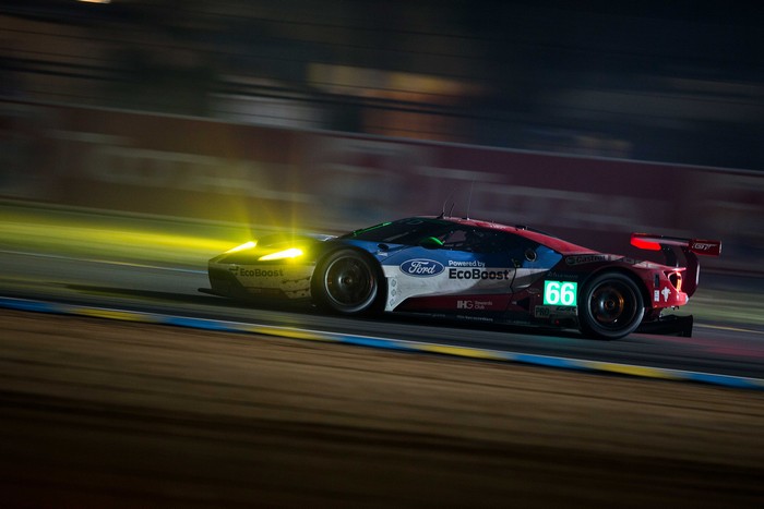 Ford GT race car with number 66 at night