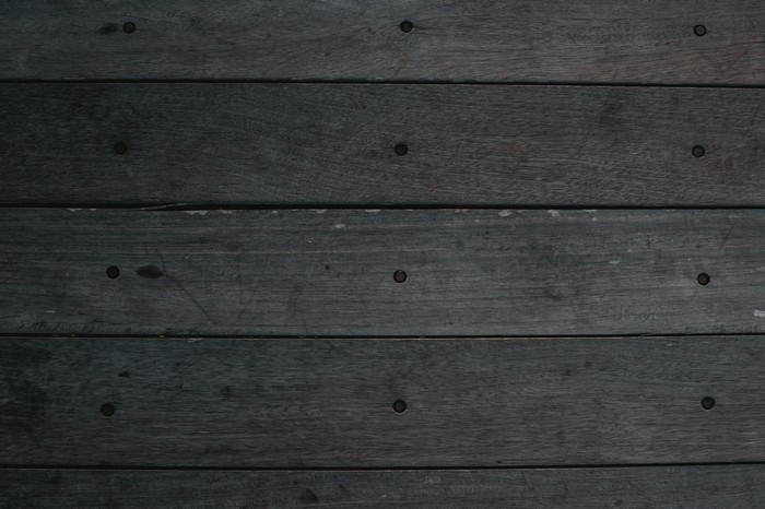 Dark wood texture with nails
