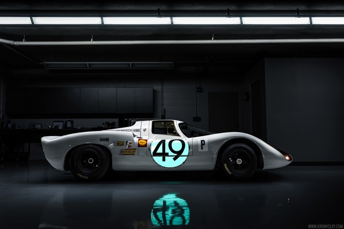 Porsche 907 race car in a garage