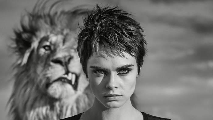 Cara Delevingne with a lion in monochrome