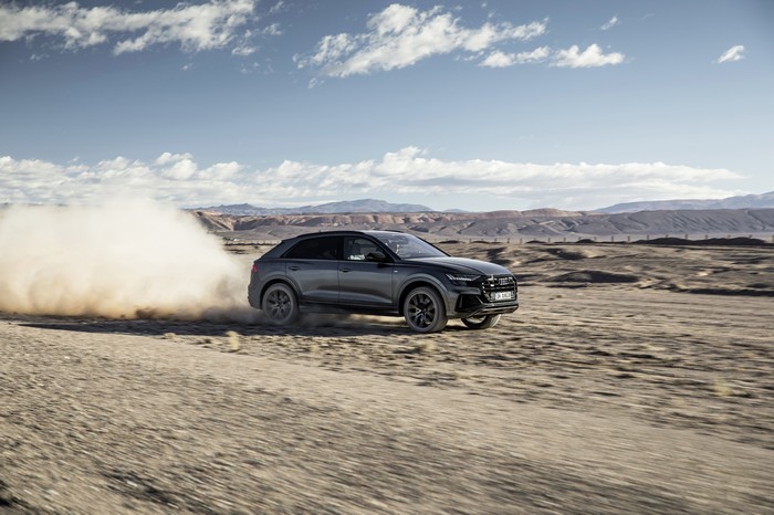 Audi Q8 driving on a dirt road