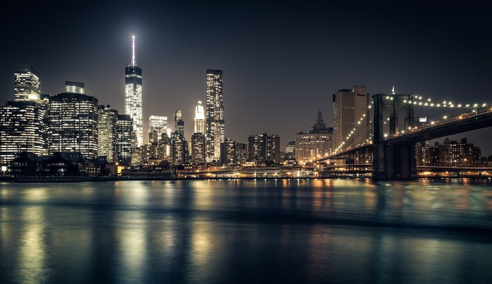 New York City skyline and Brooklyn Bridge at night