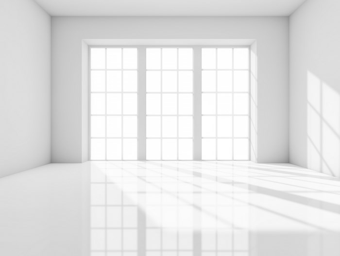 Empty white room with large windows