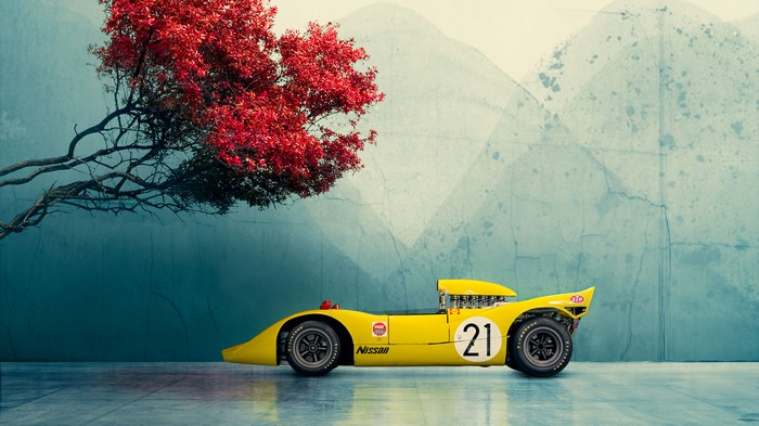 Yellow Nissan R382 racing car with red tree