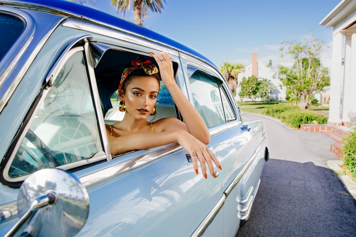 Kathleen Lights in a vintage car