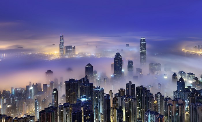 Hong Kong skyline shrouded in fog at night