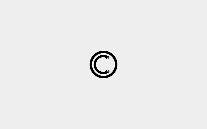 Minimalist logo with hands forming a C inside a circle