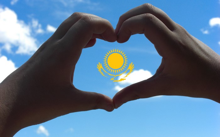 Kazakhstan flag in heart shape hands