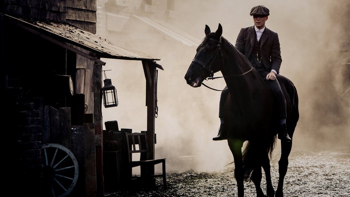 Man Riding Black Horse in Misty Peaky Blinders Scene