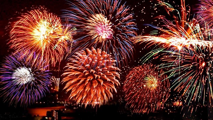 Fireworks Display Over City at Night