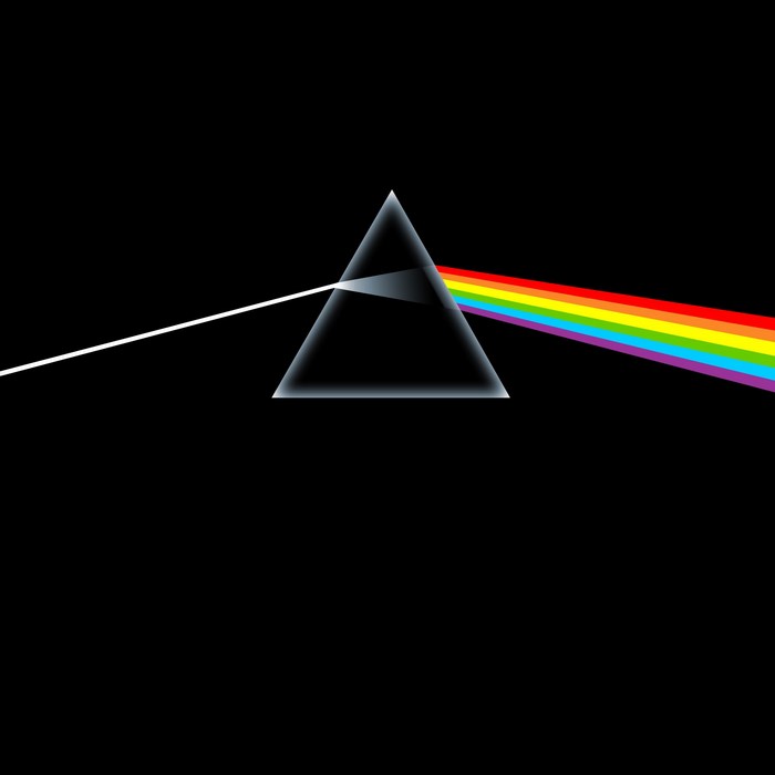 Prism refracting white light into a rainbow spectrum