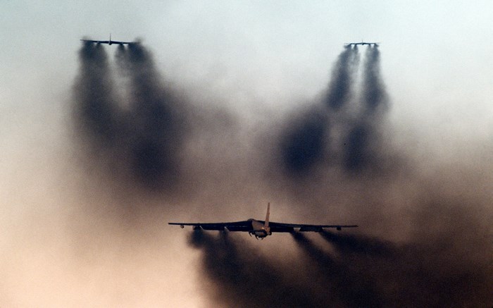 Boeing B-52 Stratofortress aircraft releasing smoke