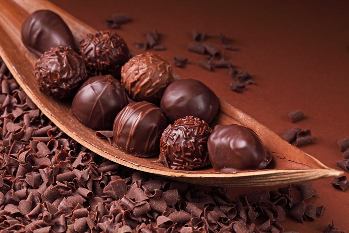 Assortment of chocolate truffles on a leaf dish