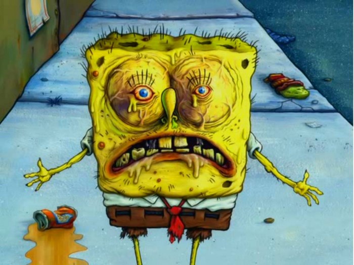 SpongeBob SquarePants looking sickly on a sidewalk