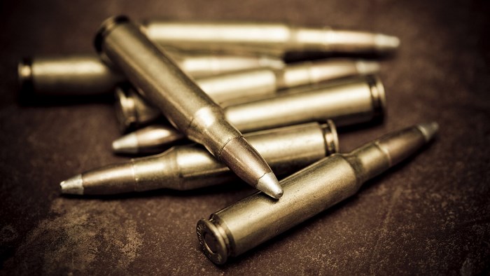 Pile of bullets on a textured surface