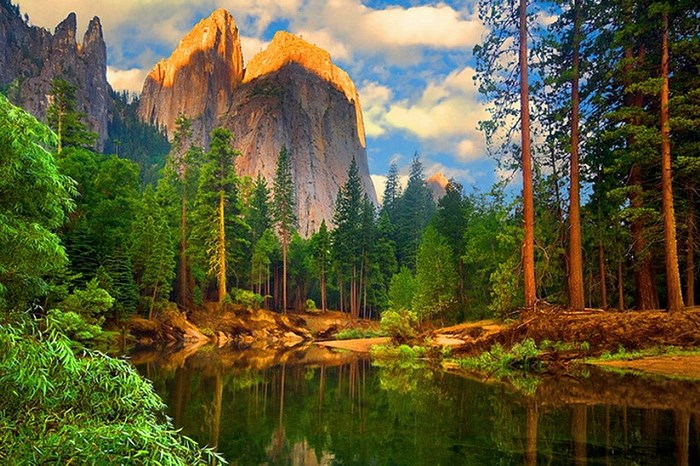 Mountain Peak Overlooking Calm River and Pine Forest