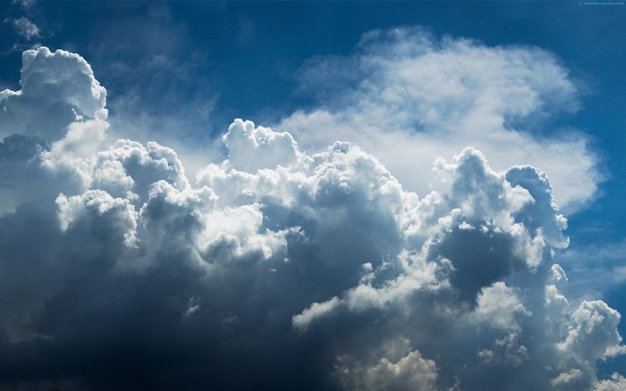 Cumulonimbus clouds against a blue sky