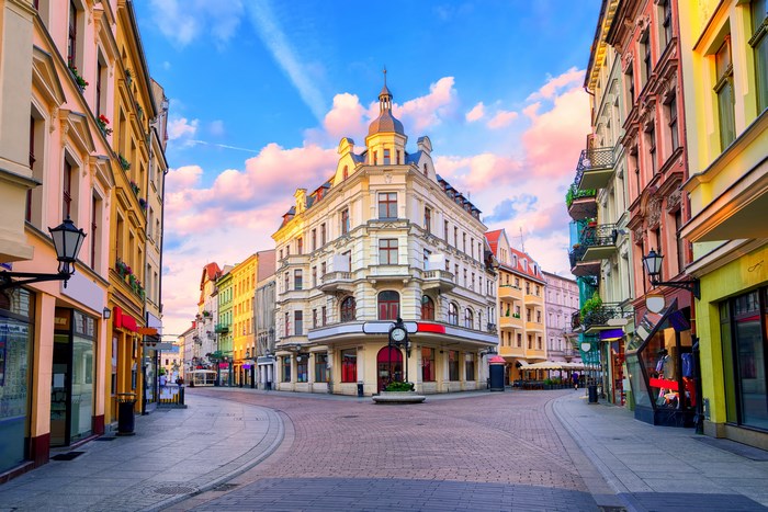 City street with colorful buildings and cloudy sky