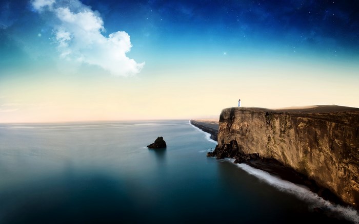 Lighthouse on a cliff overlooking the ocean