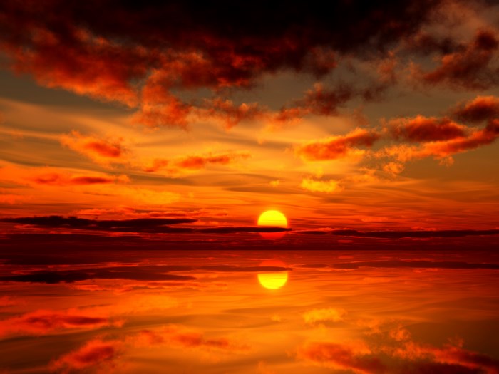 Sunset over the ocean with reflection