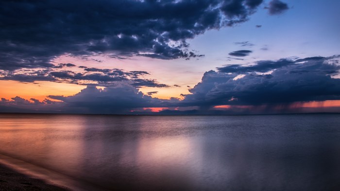 4K sunset over the ocean with clouds