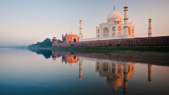 Taj Mahal Reflected in Calm River at Sunrise