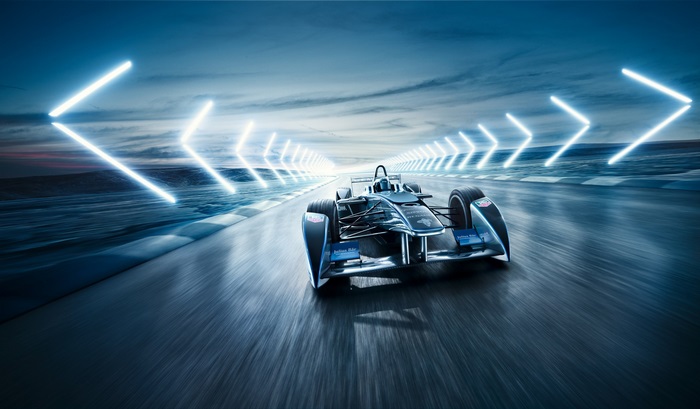 Formula E racing car on track with neon lights