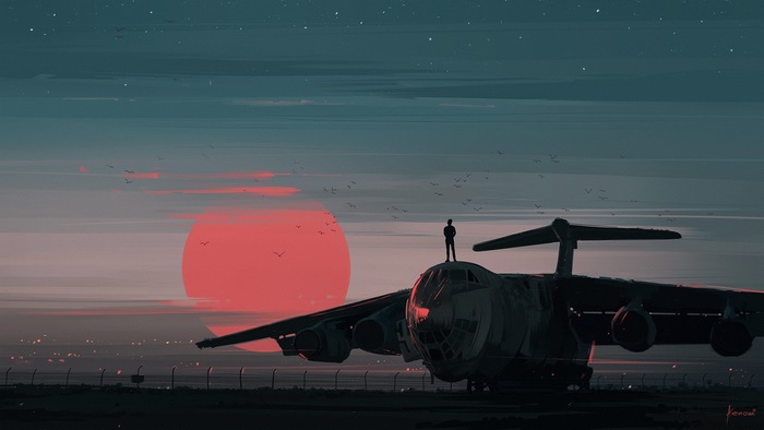 Silhouette of Man Standing on Cargo Plane at Sunset