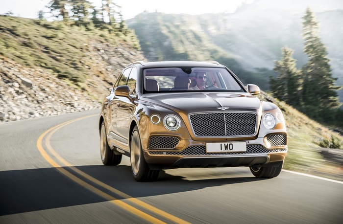 Bentley Bentayga driving on a mountain road