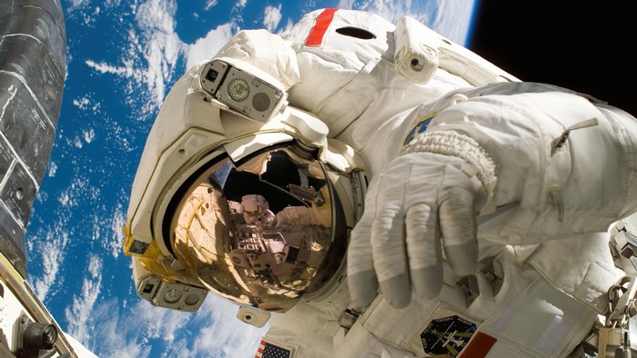 Astronaut in space with Earth in background