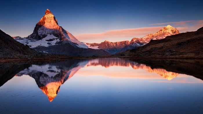 Sunset Over Majestic Mountain Reflecting on Calm Lake 4K