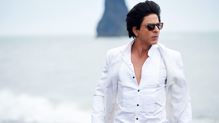 Shah Rukh Khan in a white suit on a beach