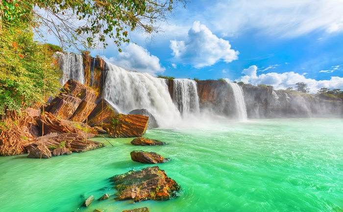 4K Scenic Waterfall with Vibrant Green Water