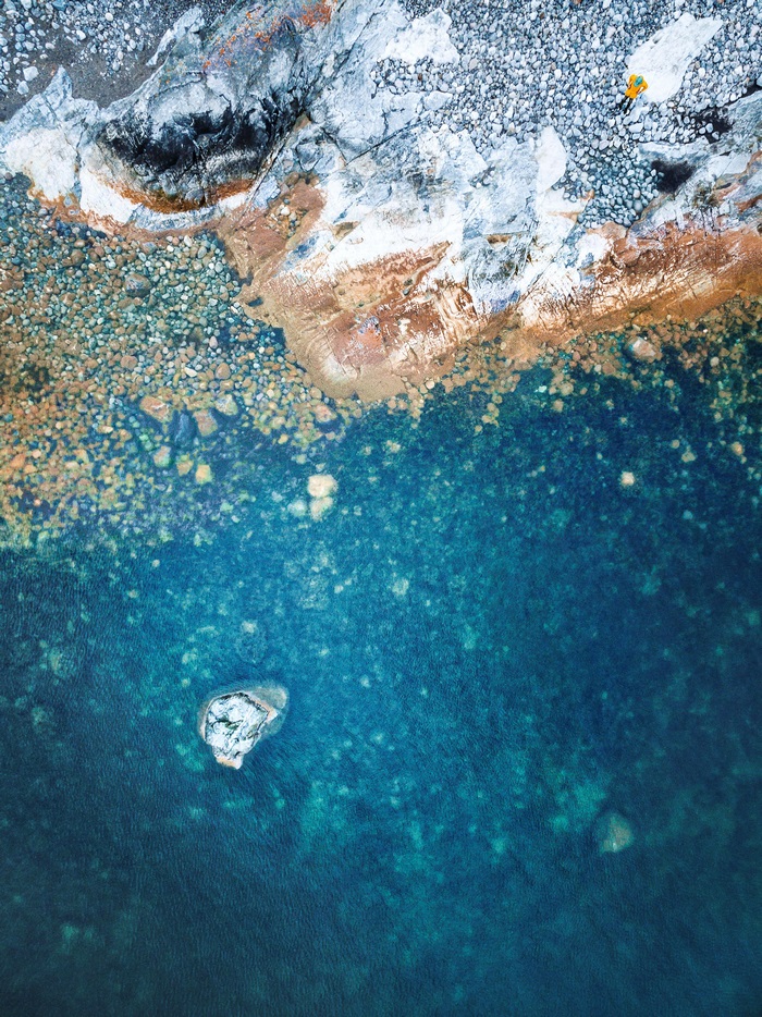 Aerial view of rocky coastline and turquoise water