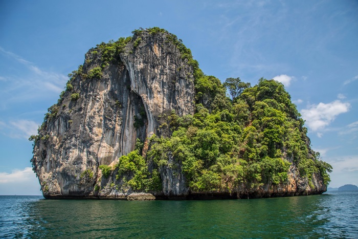 Island in the ocean with blue sky