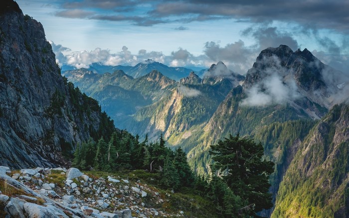 Mountain Range with Forest and Cloudy Sky