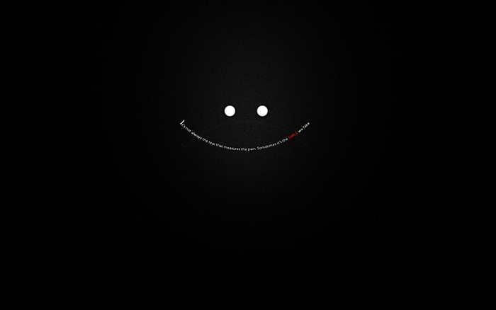 Smiling Face with a Sad Quote in Darkness