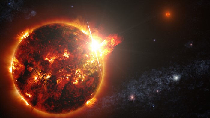 Sun with solar flares and distant stars